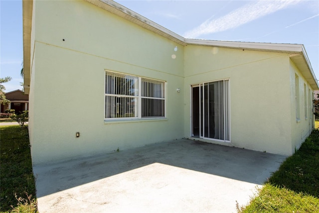 back of property with a patio area