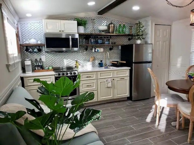 kitchen with sink, tasteful backsplash, stainless steel appliances, and dark hardwood / wood-style flooring