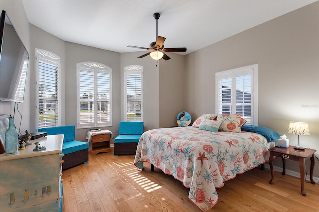 bedroom featuring ceiling fan and light hardwood / wood-style floors