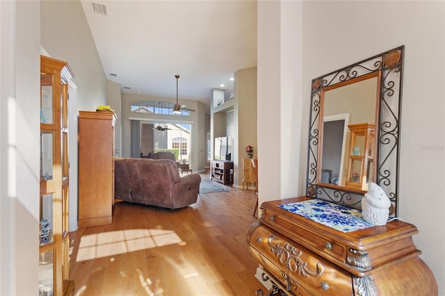 interior space featuring ceiling fan and light wood-type flooring