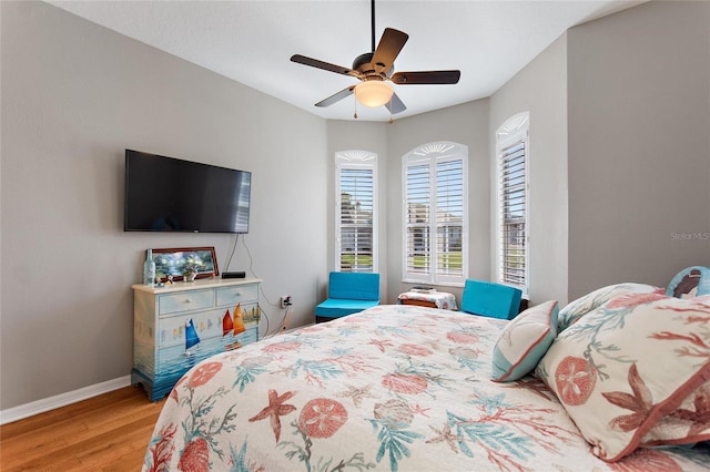 bedroom featuring ceiling fan and light hardwood / wood-style floors