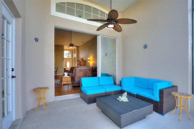 living room featuring light colored carpet and ceiling fan