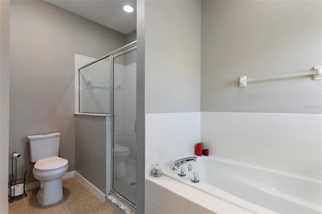 bathroom with shower with separate bathtub, tile flooring, and toilet