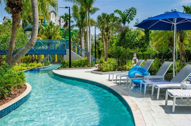 view of swimming pool featuring a patio