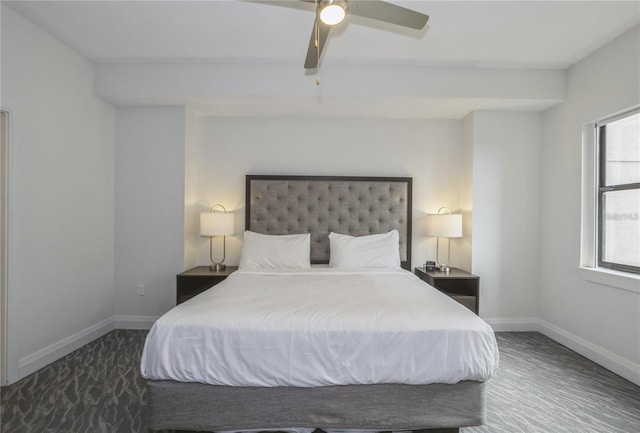 bedroom with ceiling fan and multiple windows