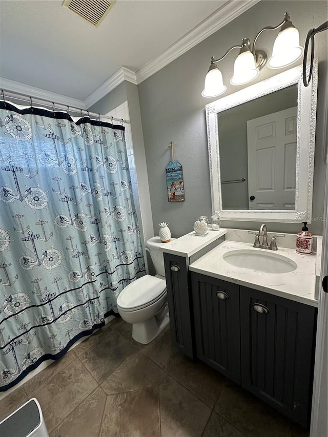 bathroom with ornamental molding, toilet, tile floors, and vanity