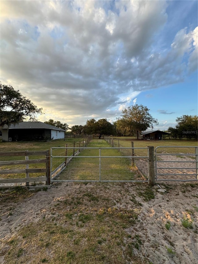 view of yard with a rural view