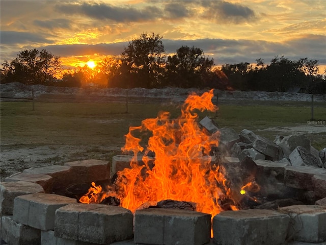 property view of water featuring an outdoor fire pit