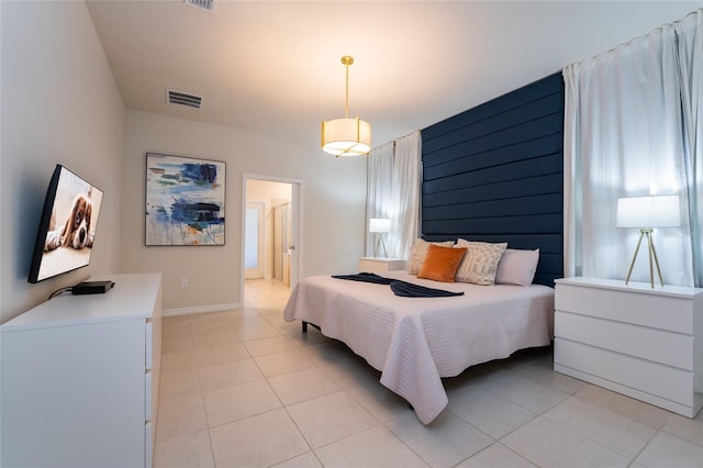 bedroom featuring light tile flooring