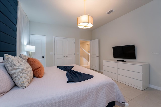 bedroom featuring light tile floors