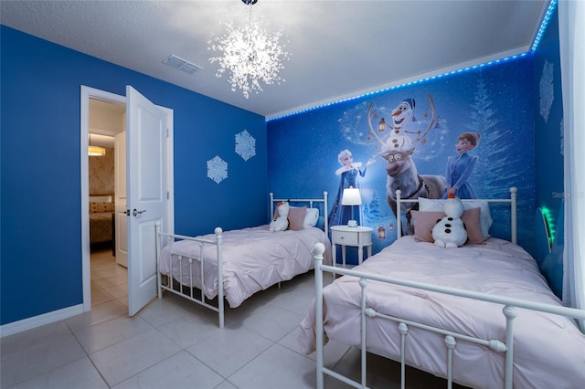 bedroom with an inviting chandelier and light tile flooring