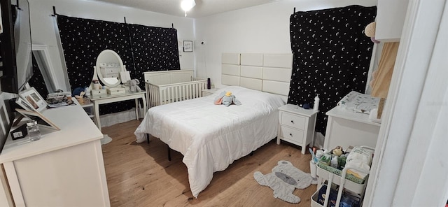 bedroom with light hardwood / wood-style flooring