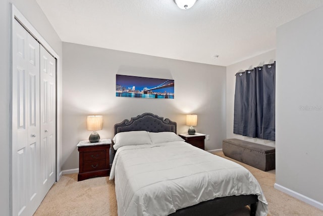 carpeted bedroom with a closet