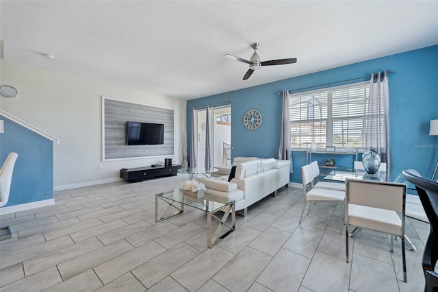 tiled living room featuring ceiling fan