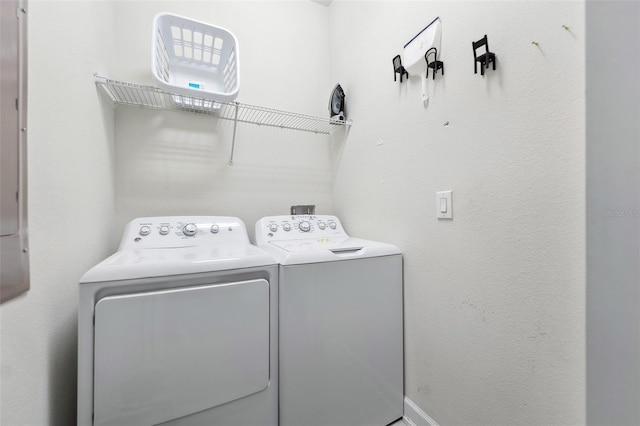 washroom with washing machine and clothes dryer