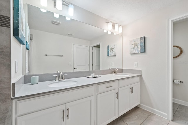 bathroom with tile flooring and double sink vanity