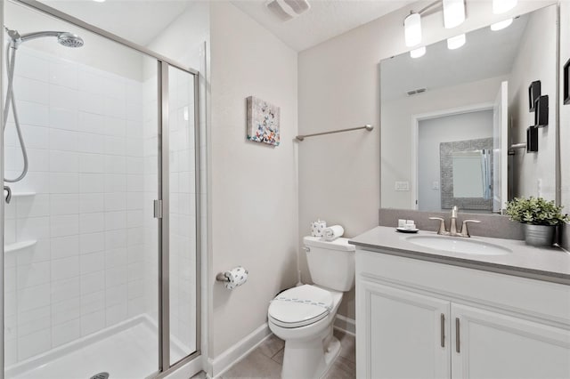 bathroom with tile floors, toilet, a shower with door, and vanity with extensive cabinet space