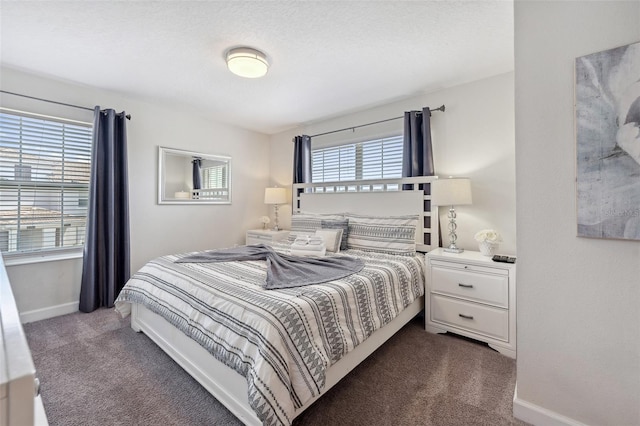 bedroom featuring dark colored carpet