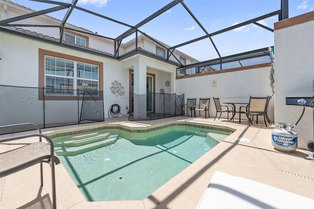 view of pool featuring a patio area and a lanai