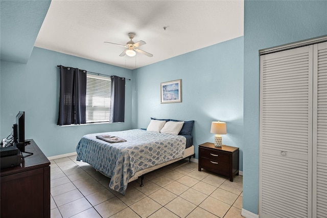 tiled bedroom featuring ceiling fan