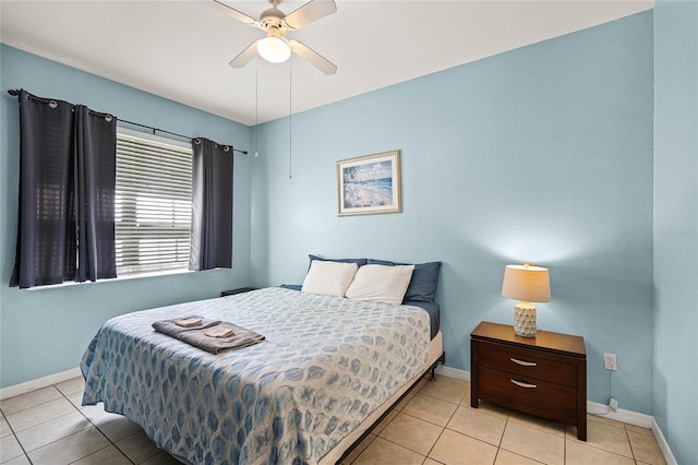 bedroom featuring ceiling fan and light tile flooring