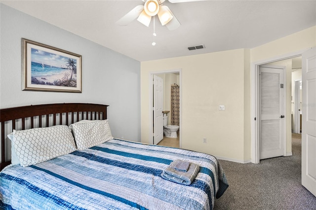 bedroom with ceiling fan, ensuite bathroom, and light carpet