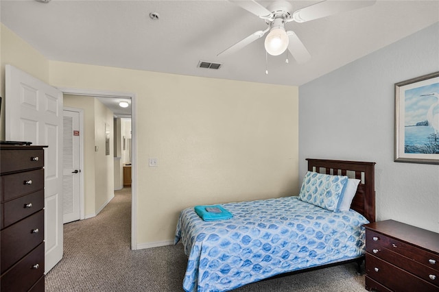 bedroom with ceiling fan and dark carpet