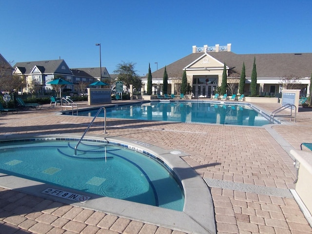 view of swimming pool with a patio