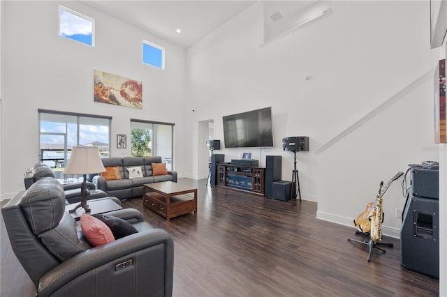 living room featuring dark hardwood / wood-style flooring and a high ceiling