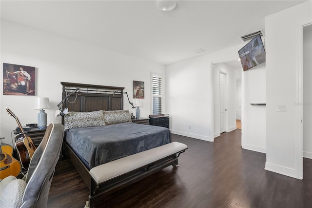 bedroom featuring dark hardwood / wood-style floors