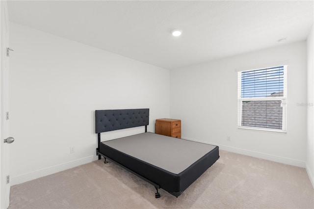 bedroom with light carpet