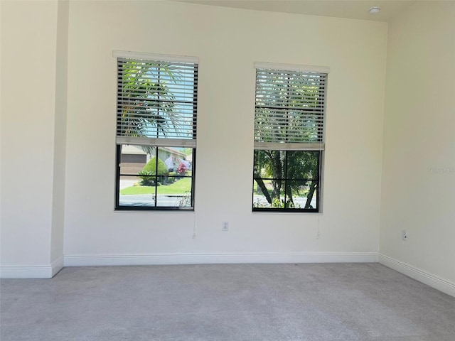 unfurnished room featuring carpet