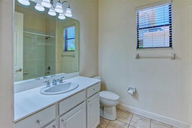 bathroom with tile flooring, oversized vanity, and toilet