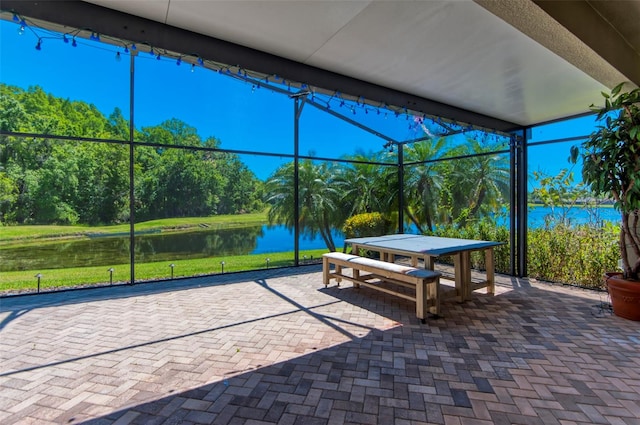 view of terrace with a water view