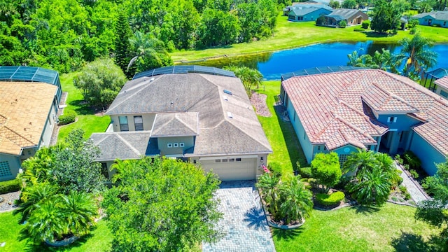 birds eye view of property with a water view