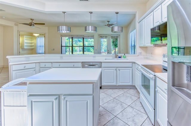 kitchen with appliances with stainless steel finishes, sink, ceiling fan, and light tile floors