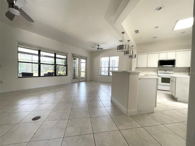 kitchen with hanging light fixtures, electric range, ceiling fan, and light tile flooring