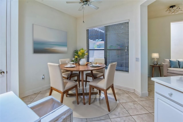 tiled dining room with ceiling fan