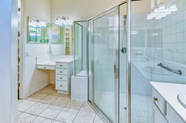 bathroom featuring walk in shower, tile flooring, and vanity with extensive cabinet space