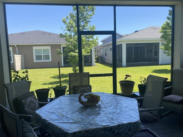 2410 Datura Loop, Saint Cloud, FL 34772 - sunroom featuring outdoor dining area