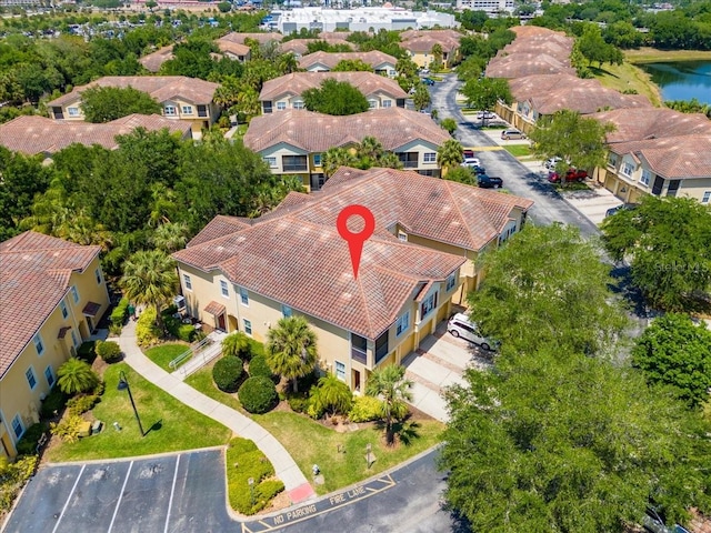 birds eye view of property featuring a water view