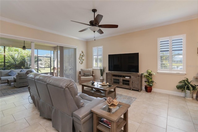 tiled living room featuring a healthy amount of sunlight, ceiling fan, and crown molding