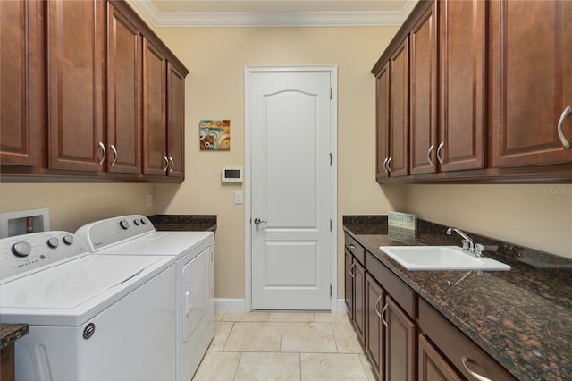 laundry area with cabinets, sink, crown molding, and washer and dryer