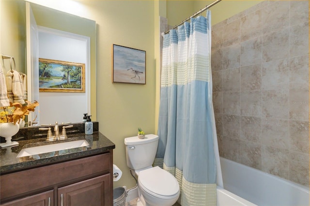 full bathroom featuring oversized vanity, shower / tub combo, toilet, and plenty of natural light