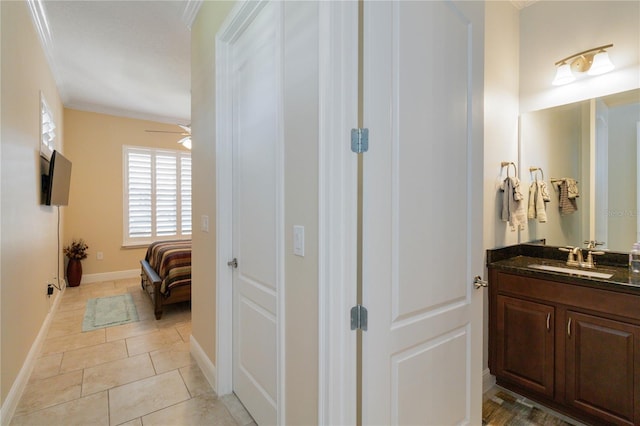 bathroom with ceiling fan, vanity, tile floors, and ornamental molding