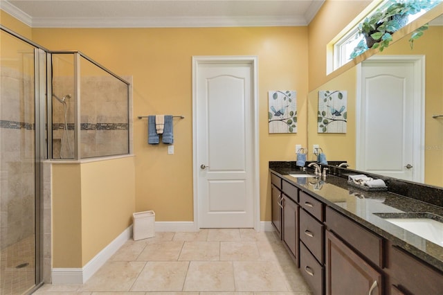 bathroom featuring ornamental molding, tile floors, walk in shower, and dual vanity