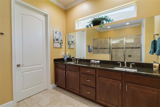 bathroom featuring a shower with door, ornamental molding, dual vanity, and tile flooring