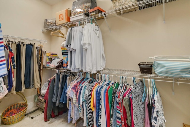 spacious closet featuring light tile floors