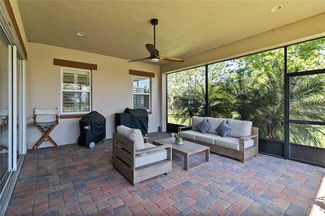 sunroom featuring a wealth of natural light and ceiling fan