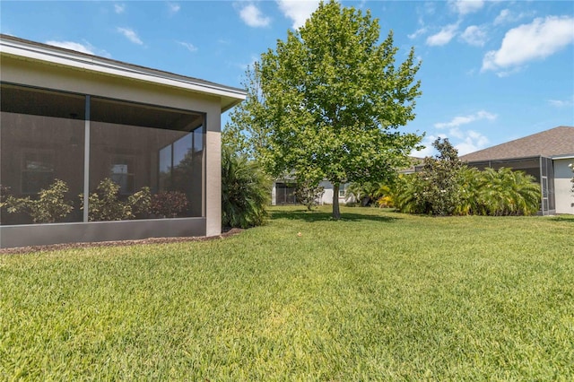 view of yard with a sunroom